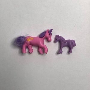 tiny little ponies pink and purple 1 inch 1/2 an inch miniature small dolls